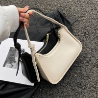 デザインニッチバッグ女性の 2024 新しい夏の多用途フランスの夏白ショルダーバッグバゲット脇の下バッグ