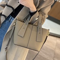 本革 レディースハンドバッグトートバッグ大容量新しいハイエンドニッチマザースタイルシングルショルダークロスボディバッグ