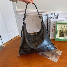 ファッショナブルでパーソナライズされたシンプルなワックスレザー脇の下バッグ 2024 新しい秋の気質多用途女性のショルダーバッグクロスボディバッグ