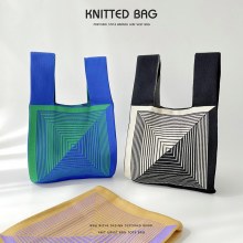 韓国スタイルのニッチなデザインの白黒の紙の形をしたニットショルダーハンドバッグ、多用途でハイエンドのストリートリストバッグ