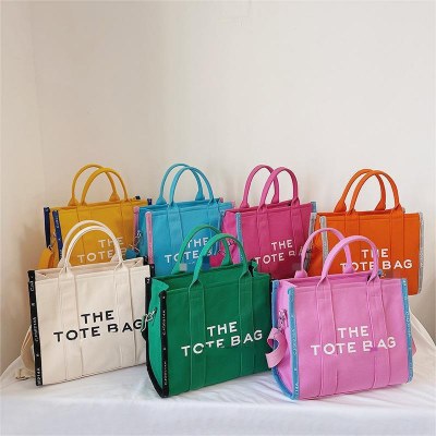 新しいシンプルなデザイン、パーソナライズされたコントラストカラーのキャンバスバッグ、大容量のポータブルクロスボディバッグ、レトロトート​​バッグ