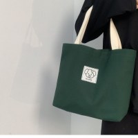 キャンバスバッグ女性のための 2024 新しい大容量シンプルな小さなバッグサラリーマン通勤バッグミニハンドバッグ