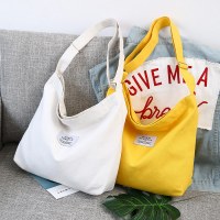 新しいスタイルのキャンバスレディースバッグ、韓国スタイルのレターショルダースクールバッグ、ポータブル大容量キャンバスバッグ