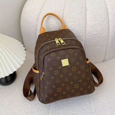 新しい Pu ファッションカジュアルプリントバックパック女性のバッグ大容量レトロ老眼トラベルバッグ通勤バックパック