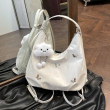 カジュアルソフト表面大容量蝶装飾ショルダーバッグ 2024 新しいファッション通勤バックパック多目的トートバッグ