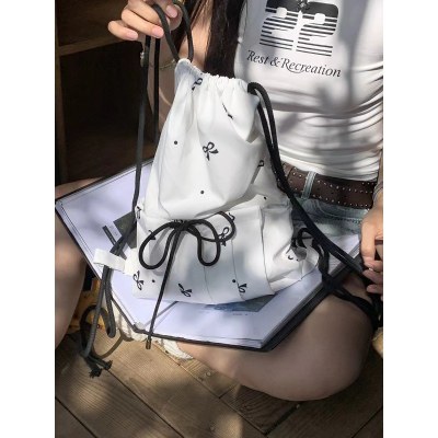 ニッチ デザイン インスタイル韓国スタイルホワイトバッグ甘いリボンプリント巾着スタイルバックパック女性用