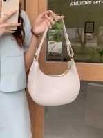 春夏の新作アンダーアームバッグ、ハーフムーンバッグ、シンプルで多用途なショルダーバッグ、テクスチャードバゲットバッグ、女性用クロスボディバッグ