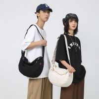 新しいカップルクロスボディバッグイン原宿ショルダーバッグキャンバスバッグ文学スタイルのセミラウンドバッグ多用途シンプルな団子バッグ