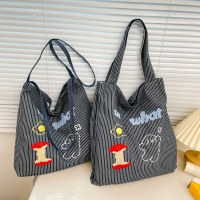韓国スタイルのファッションストライプキャンバスバッグ女性のバッグ 2024 新しい大容量通勤トートバッグニッチカジュアル布バッグ