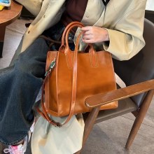 女性用牛革バッグ、高級本革ハンドバッグ、秋冬の大容量クロスボディバッグ、ファッショナブルで多用途なバケットバッグ