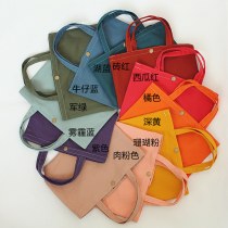 キャンディーカラーの小さな布バッグハンドバッグランチバッグハンド小さなバッグ無地キャンバス和風文学小さな新鮮で固体