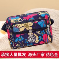 新しいスタイルのマザーバッグナイロン布女性の花布バッグシングルショルダークロスボディバッグ中高年カジュアル多層携帯電話バッグ