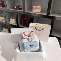 西洋スタイルのレディースバッグ、ニッチなコントラストカラーのバックパック、女性の新しい高級菱形チェーンスクールバッグ
