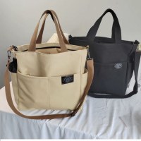 女性用ショルダーバッグ、カジュアルで多用途、レトロなマルチポケットトートキャンバスバッグ、トレンディなファッション手持ちクロスボディバッグ
