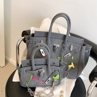 レトロなアンティーク調のパロディーピンバックルラグ乞食2023春夏の新しいスタイルのパーソナライズされたデニムワンショルダークロスボディプラチナバッグ