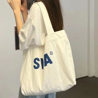 キャンバスバッグ女性のシングルショルダーカジュアル通勤大容量イン学生クラスバッグ怠惰なスタイルニッチバッグジッパートレンド