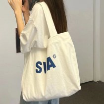 キャンバスバッグ女性のシングルショルダーカジュアル通勤大容量イン学生クラスバッグ怠惰なスタイルニッチバッグジッパートレンド
