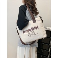 大容量の女性用通勤バッグ 2023 新作ショルダーキャンバスバッグ多用途クロスボディトートバッグ大学生クラスバッグ