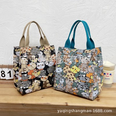 新しいポータブル ママバッグ 、かわいい漫画の機内持ち込み雑貨バッグ、レトロなファッションのお出かけハンドバッグ