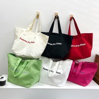大容量キャンバスレディースバッグ2024キャンディカラーレディースハンドヘルドトートバッグトレンディアーバンシンプル通勤ショルダーバッグ