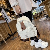バックパック女性の新しいトレンディな牛革大容量トラベルバックパック学生エンボス加工スクールバッグ