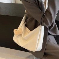 女性のためのバッグ 2024 新しいソフトレザーカジュアル大容量通勤バッグデザインレトロ多用途ショルダークロスボディバッグ