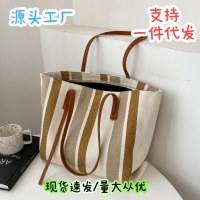 韓国スタイルの大容量レディースショルダーバッグ 2024 新しいスタイルのシンプルな縦ストライプカジュアルトートバッグファッションハンドバッグ